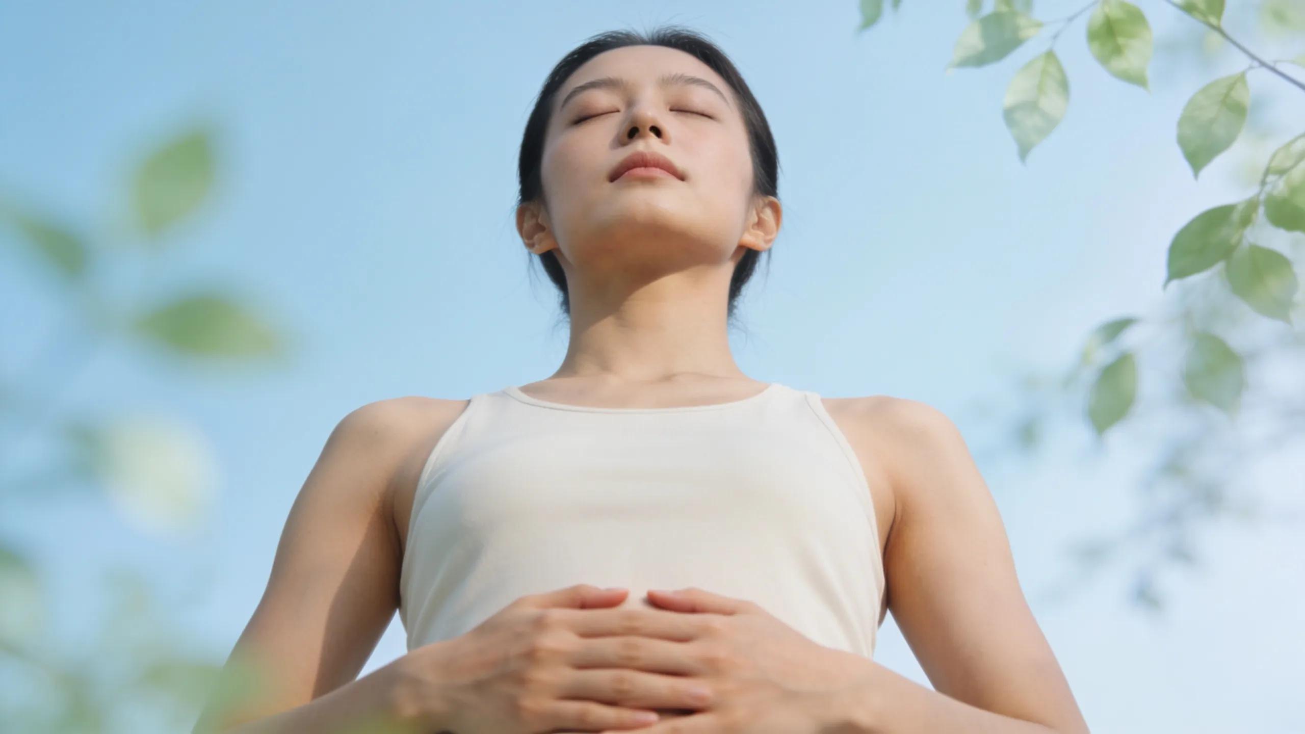 Individual practicing deep breathing for managing flight panic before therapy