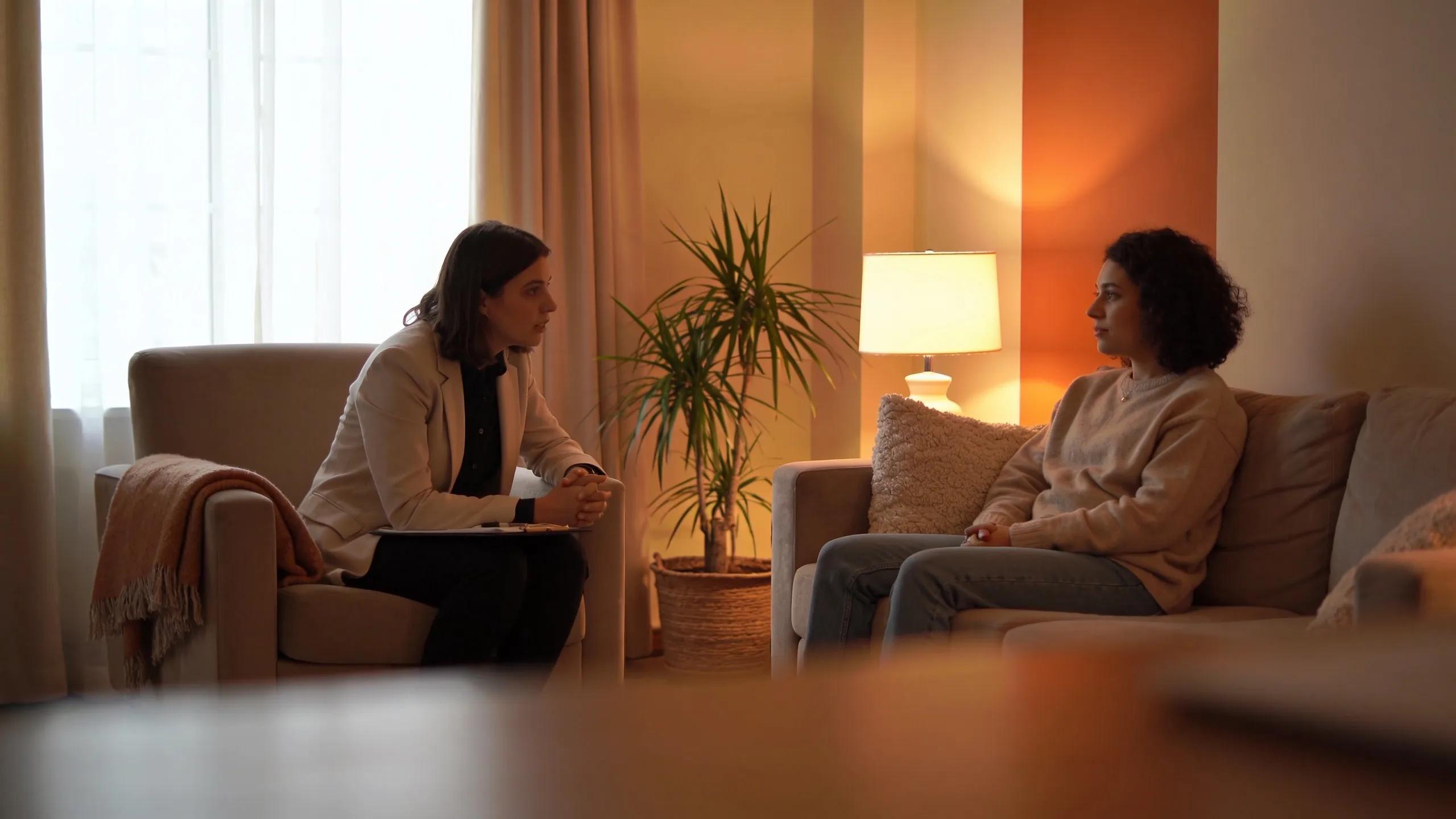 Therapist interacting with a client to help them overcome fear of heights through conversation